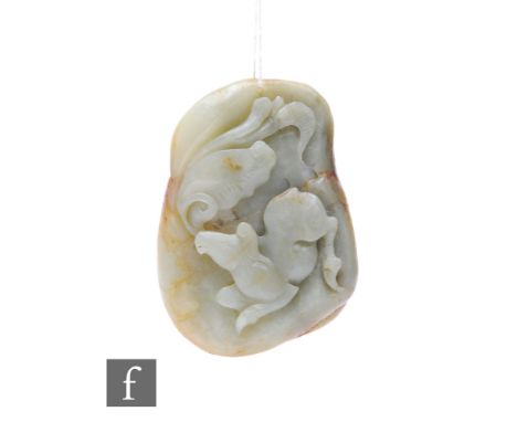 A Chinese Qing Dynasty jade pebble carving, the smooth pale green and russet stone, carved in relief with horse and lotus, 6.