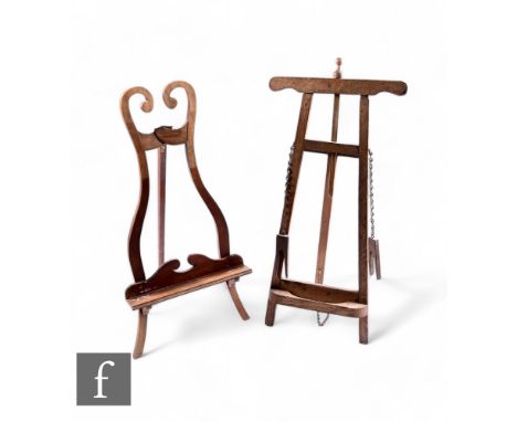 An Edwardian mahogany music style of lyre shaped scroll form with bracket shelf and plaster cameo, 93cm x 45cm, and a similar