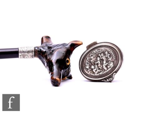 An early 20th Century walking stick, the handle carved with a double fox head inset with glass eyes and a small continental o
