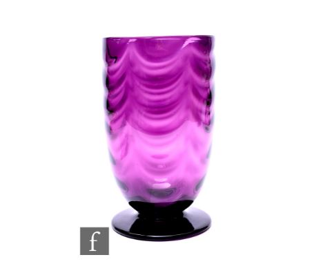 A Whitefriars amethyst glass vase from the Wealdstone range, pattern no.9147, of footed form with optical moulded swag patter