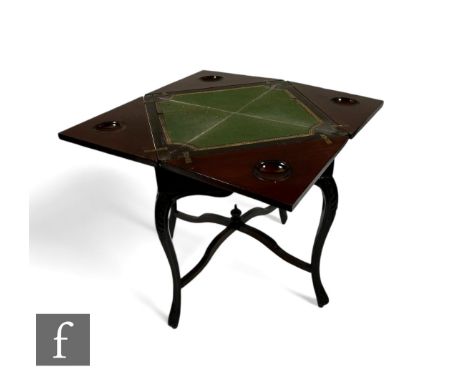 A late Victorian mahogany envelope card table, the square moulded edge top over a plain frieze on slender carved cabriole leg