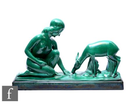 A French ceramic sculpture in the Art Deco style, modelled as young woman and fawn,&nbsp; in emerald green enamel on ceramic,