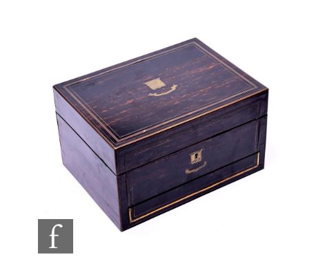 A 19th Century coromandel and brass inlaid dressing table box, the lid opening to reveal a fitted interior with plated jars, 