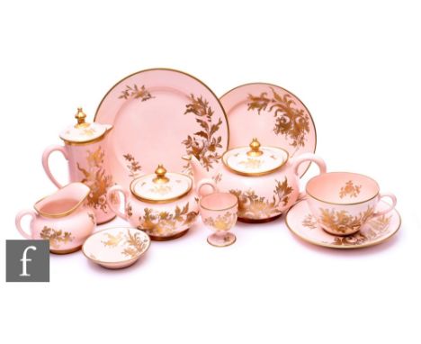 A French porcelain 'Orlik' hand painted part breakfast set, gilded floral sprays over dusty pink ground, comprising teapot, h