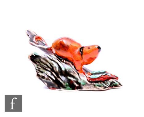 An Anita Harris glazed model of mouse on part of a trunk, signed to base, width 13cm. Condition reports for each lot are avai