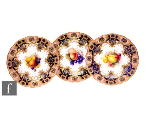 Three Royal Worcester painted dessert plates, circa 1920, each decorated with still life studies of fruit and flowers, within