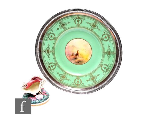 A Royal Worcester cabinet plate by James Stinton, circa 1930, central roundel painted with grouse amongst heather in mist shr