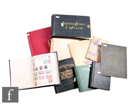 An extensive old world stamp collection contained in various albums, also a small album of British stamps including a penny b