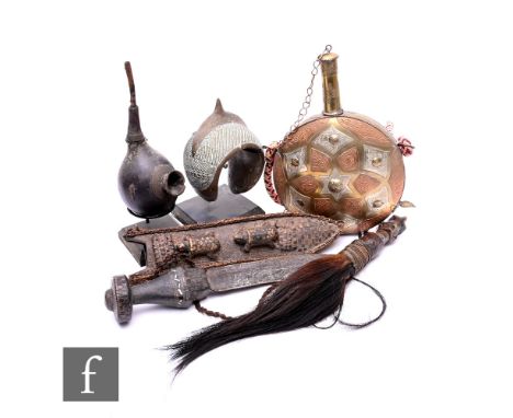 A collection of assorted African items, to include a smoking pipe and stand, a copper and brass water flask, a tribal dagger,