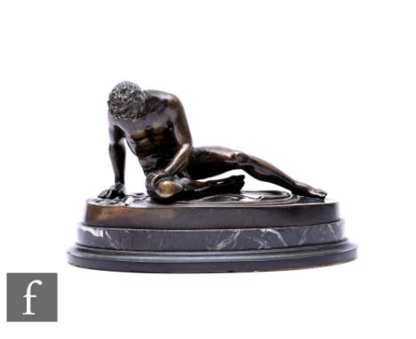 A bronze figure of a dying Gaul, after the antique, on oval base, unsigned, width 18cm. Condition reports for each lot are av
