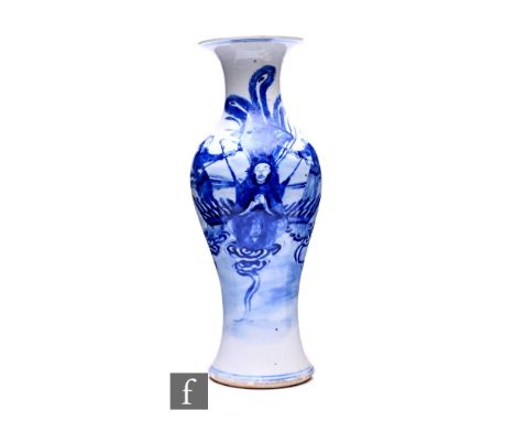A 19th Century Chinese Kangxi style blue and white baluster form vase, the white ground detailed in ring cobalt blue with imm