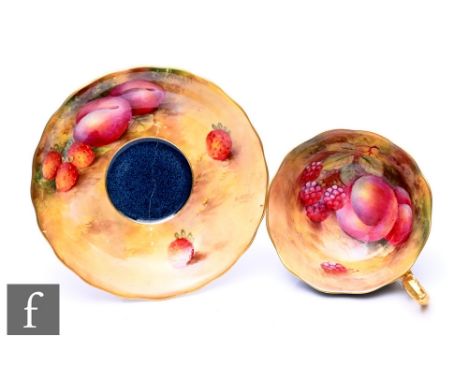 A Royal Worcester fruit painted cabinet cup and saucer, circa 1928, decorated with peaches and strawberries over most covered
