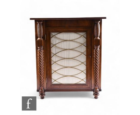 A Regency style rosewood crossbanded mahogany side cabinet, fitted shelf interior enclosed by a brass grill and curtained doo
