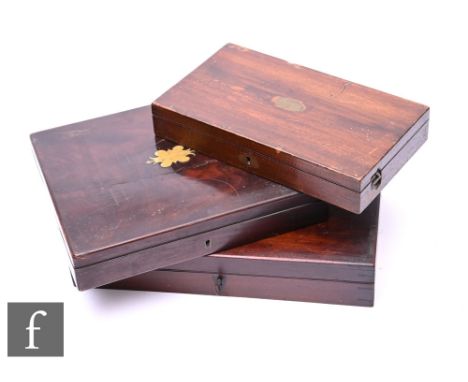 A 19th Century mahogany case for a pair of pistols and tools, plush lined interior, and two similar mahogany cases lacking th