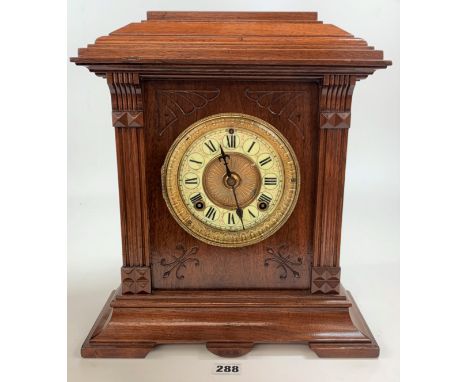 Brass faced wooden 2 hole mantle clock with pendulum and key 15” high x 13” wide