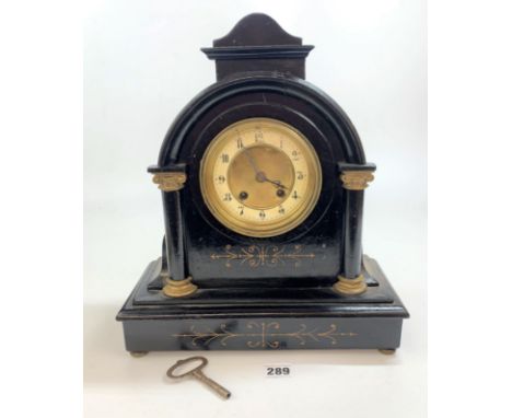 Black painted wooden and brass faced 2 hole mantle clock with pendulum and key 14” high x 12” wide 