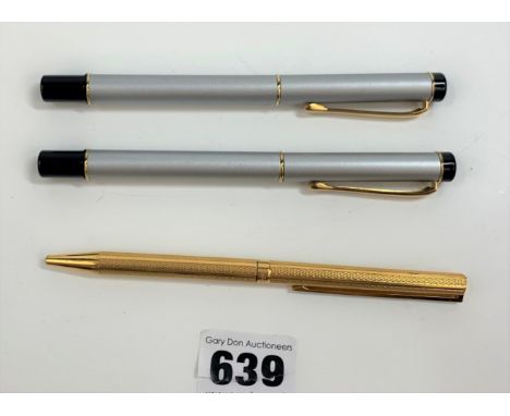 Silver/black fountain pen and matching roller ball pen and gold coloured roller ball pen