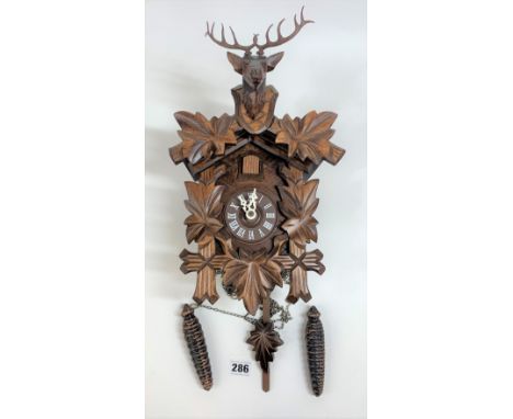 Cuckoo clock with stag head 13” long with pendulum and 2 weights