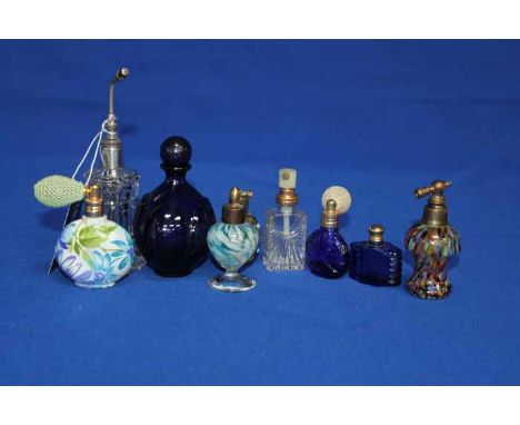COLLECTION OF SCENT BOTTLES AND ATOMISERS
including cut and coloured glass, gilt, ceramic, etc