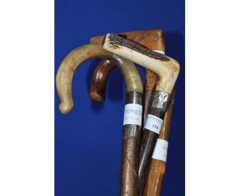 VICTORIAN WALKING STICK 
with silver band and horn handle also two other waliking sticks and a crook (4)