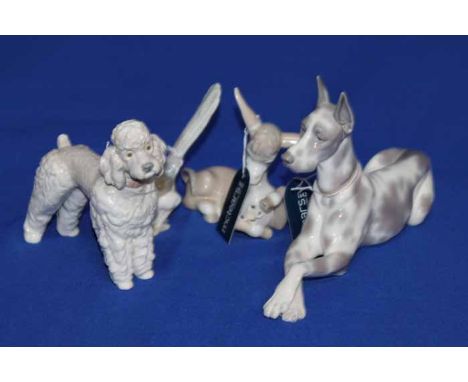 FOUR LLADRO ANIMAL FIGURES
including a Great Dane, a poodle, a wagtail and a donkey, largest 33cm long