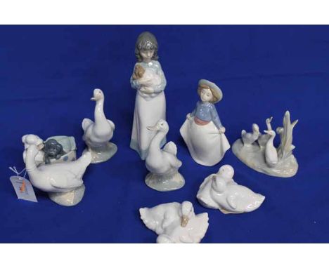 COLLECTION OF NINE NAO FIGURINES