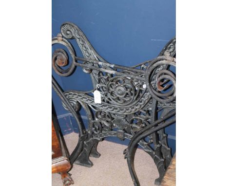 PAIR OF CAST IRON BENCH ENDS 
together with a pair of cast iron table legs 