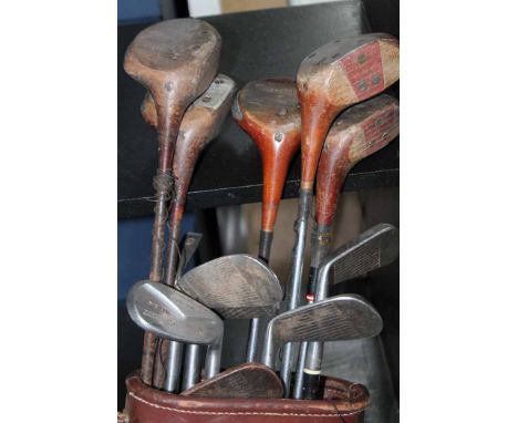 VINTAGE SET OF GOLF CLUBS
in a tan leather case
