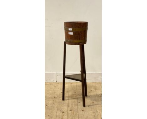 A coopered oak jardiniere stand, R A Lister &amp; Co, H92cm
