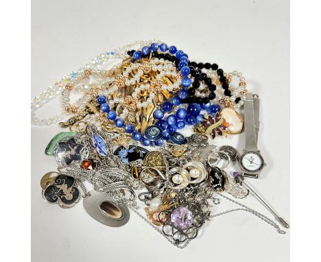 A large collection of costume jewellery including an Austrian style crystal bead necklace, a blue plastic bead necklace, gilt