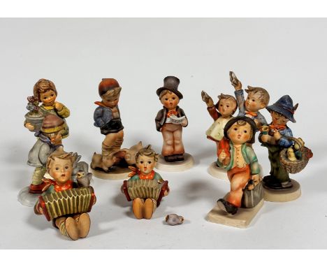 A collection of nine various Hummel pottery figures including Merry Wanderer, Easter Greetings, My Wish is Small etc (tallest