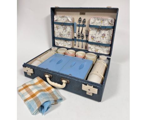 A Brexton mid century picnic case complete with original pink ceramic cups, serving plates, chromium plated flatware, sandwic