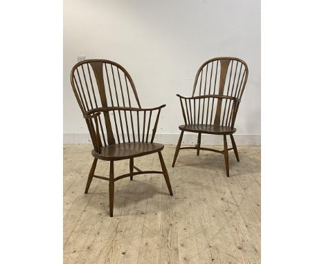 Ercol, a Pair of Windsor type stained beech and elm chairs, double hoop and spindle back over shaped seat, raised on turned s