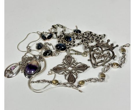 A collection of silver and white metal jewellery including a stylised cross on silver Albert, with two lobster claws, a silve