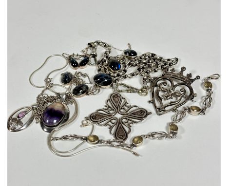 A collection of silver and white metal jewellery including a stylised cross on silver Albert, with two lobster claws, a silve