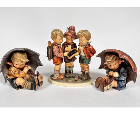 A Hummel pottery figure group School Boys, (20cm x 15cm x 9cm) and a pair of Hummel pottery figures, Umbrella Girl and Umbrel