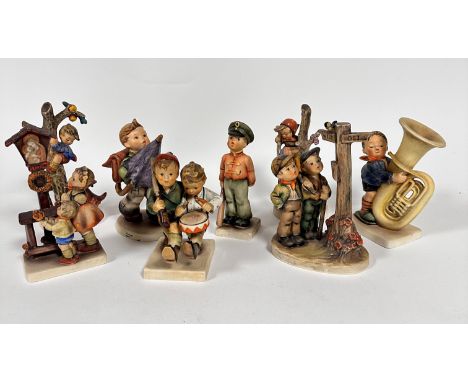 A pair of Hummel pottery figure Apple Tree Boy and Girl, a Hummel pottery figure of Madonna and Infant Jesus, a Hummel potter