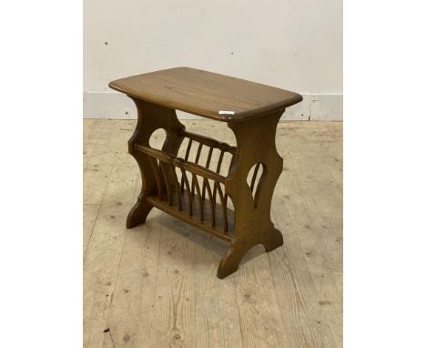 Ercol, a stained elm Canterbury table, on shaped panel end supports, H50cm, W55cm, D36cm