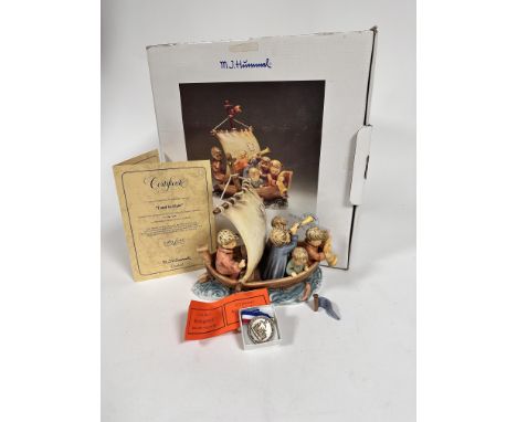 A Hummel figure pottery group, Land in Sight, with figures in a sail boat, one small flat a/f, complete with medal, original 