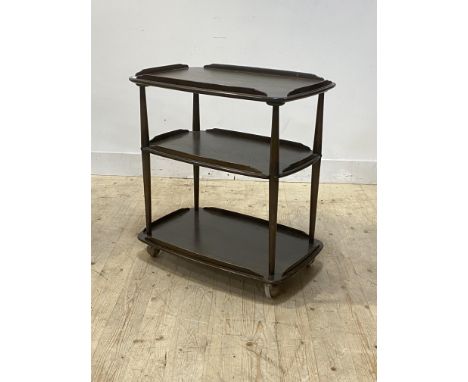 Ercol, a three tier drinks trolley, moving on castors,  in dark fume, H78cm, W71cm, D47cm