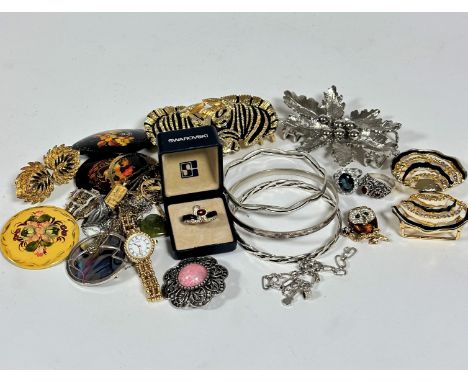 A collection of costume jewellery including a silver lattice band bracelet, (d 7cm)a plain silver bangle (d 7cm) a Swarovski 