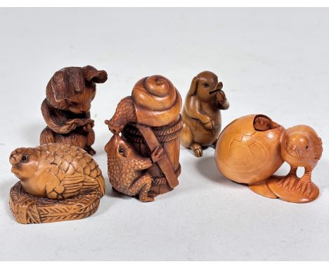 A Japanese style carved wood netsuke of a Partridge with inset bead eyes (3cm x 4cm), a Japanese carved wood netsuke of a Sna