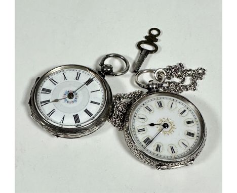 An 800 standard Edwardian lady's open face fob watch with enamelled dial and Roman numerals with engraved all over scrolling 
