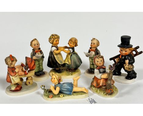 A collection of Hummel pottery including Miss Behaving, Limited Edition recumbent figure, Spring Time Dance, Little Choir Boy