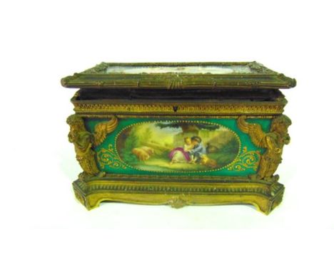 A good quality 19th century casket with embossed gilt metal panels enclosing dark green ground ceramic panels incorporating W