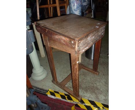 A vintage oak childs school desk with hinged slope