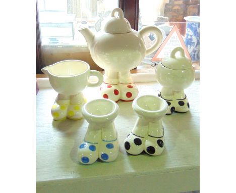 A collection of Carltonware Big Foot wares designed by Roger Michell and comprising a teapot and cover with red spotted shoes