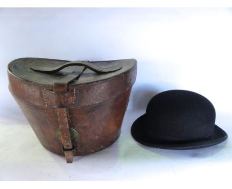 A good quality 19th century stitched and tanned leather hat box of usual form with brass plaque bearing lettering W F Egerton