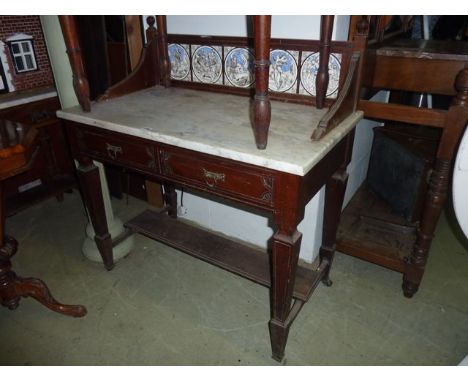 A late Victorian mahogany marble top washstand, the raised splashback incorporating a frieze of five Moyr Smith printed tiles