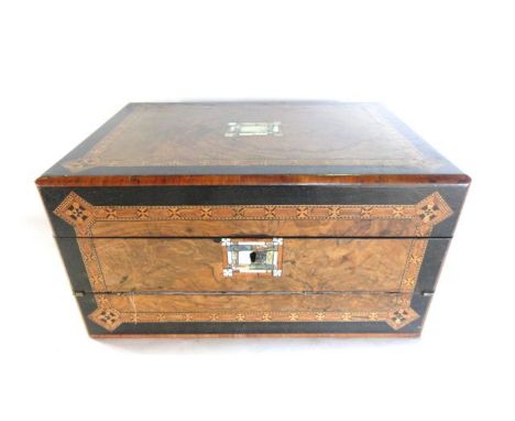 A good quality 19th century travelling box principally in walnut veneer with extensive ebonised framed stained timber parquet